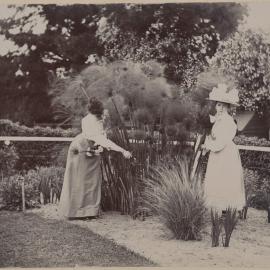 [Two women in garden,] Harleston