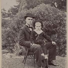 [Norton Grimwade seated with boy,] Harleston