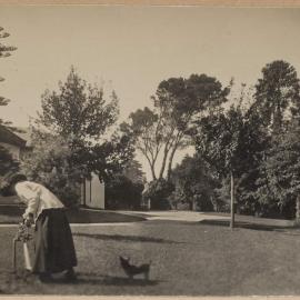 [Woman in garden with dog]
