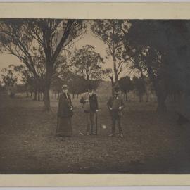 [Group photo of unidentified woman and two men]