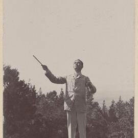 [Tennis ball mid air]