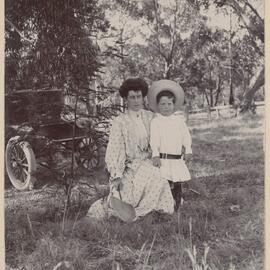 Woolwogong [kneeling woman and young boy]