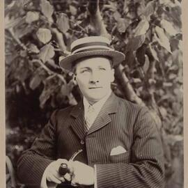 Harleston [seated portrait of man wearing hat and holding pipe]