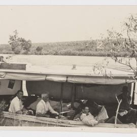 [Men sitting in boat, 'The Thistle']