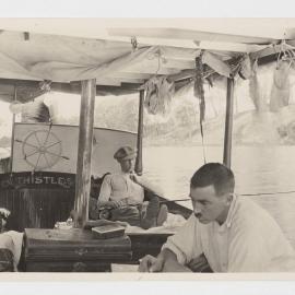 [Man fishing from boat, 'The Thistle']