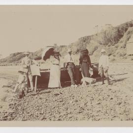 [Group photo posing on beach]