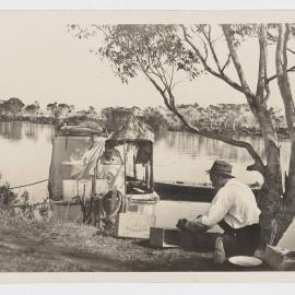[Boat moored on river bank]