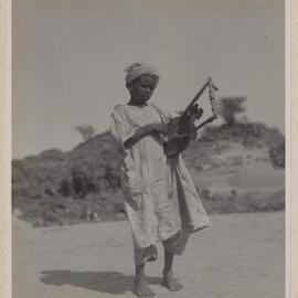 [Child wearing white robe and turban at Abydos]