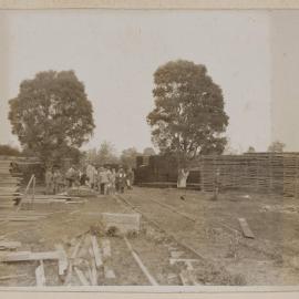 [Crowd gathered at sawmill]