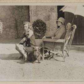 [Mabel Grimwade with dog and woman in garden chairs at Westerfield]