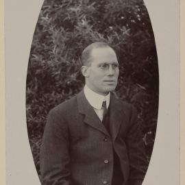 [Half-length portrait of man wearing glasses and three-piece suit]