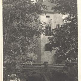 [Stone arch bridge over river , beside stone house, Austria]