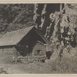 [Wooden cabin next to rock face, Austria]