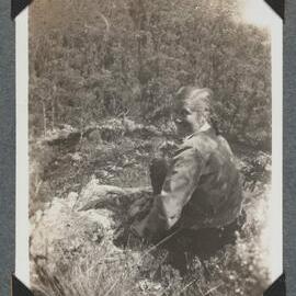 [Mountaineering Club Tasmania trip - woman seated in a foreground]