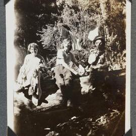 [Mountaineering Club Tasmania people sitting on a log]